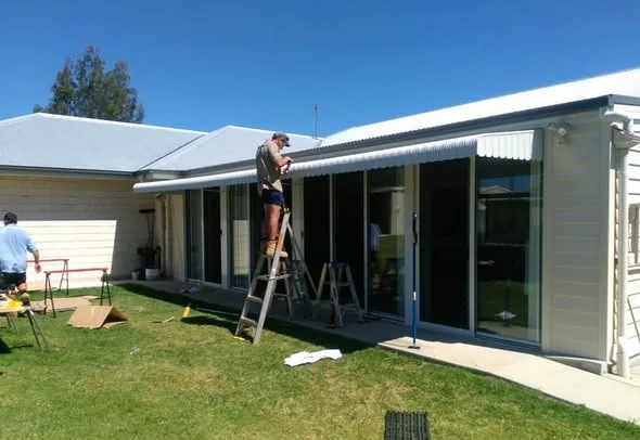 Andrew fitting an awning to a Toowoomba home
