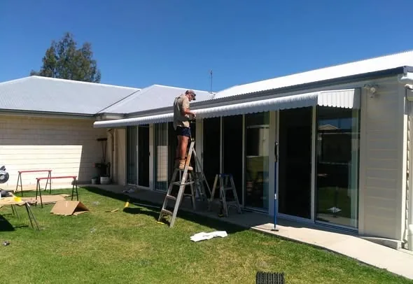 Andrew fitting an awning to a Toowoomba home