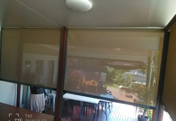 Outdoor café blinds enclosing a patio